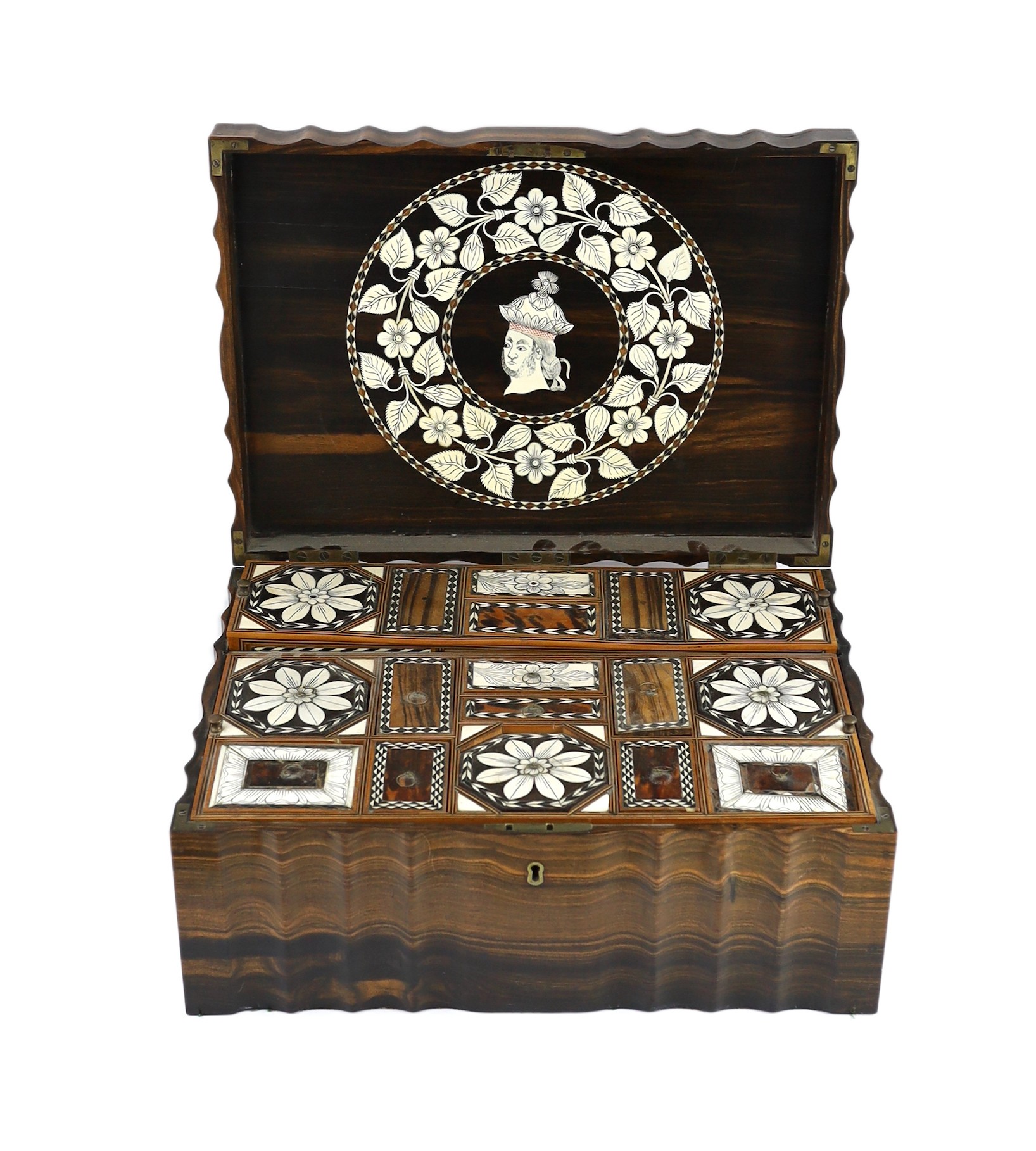 A mid 19th century Anglo Indian ivory inset ebony and other exotic hardwood travelling casket, 44cm wide 32cm deep 19cm high